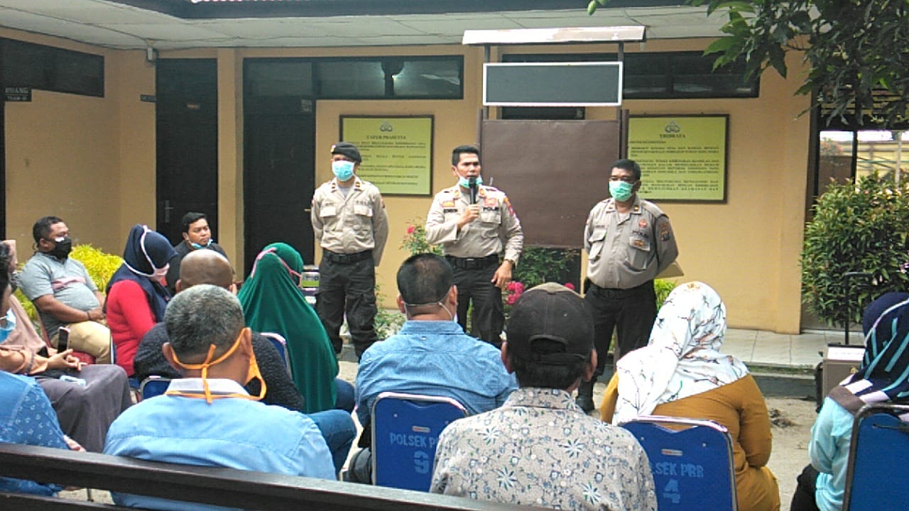 Cegah Covid-19, Kapolsek Perbaungan Giat Sosialisasi  40 Pemilik Usaha