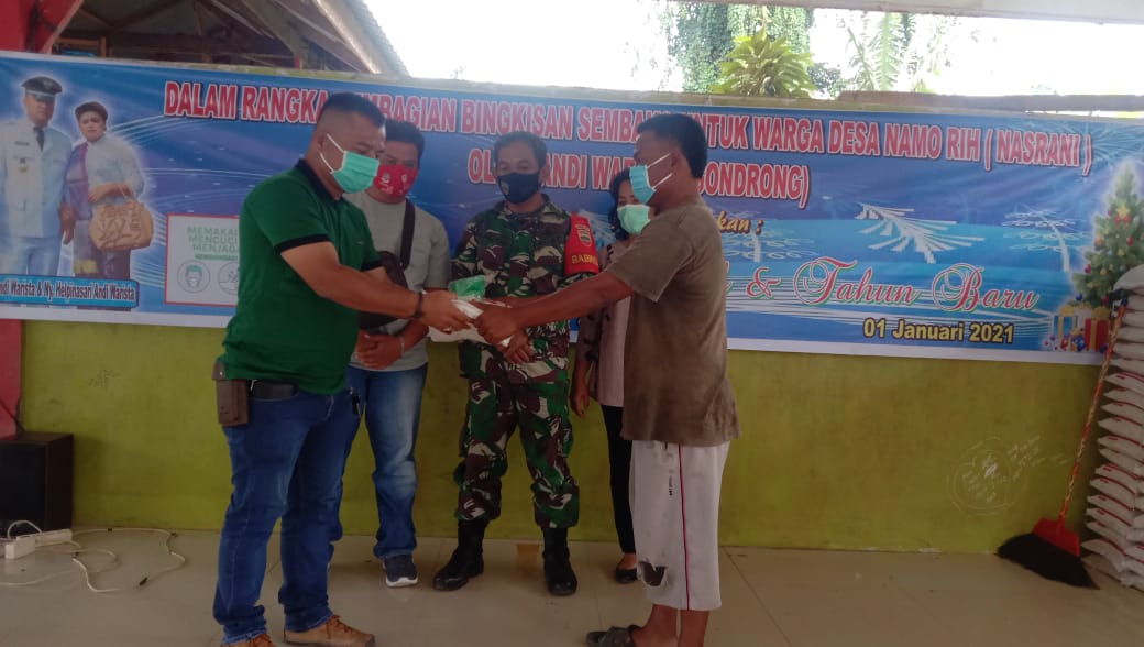 Kades Namo Rih Beri Bantuan Sembako dan Bagikan Masker kepada Warga dalam Kegiatan Doa bersama
